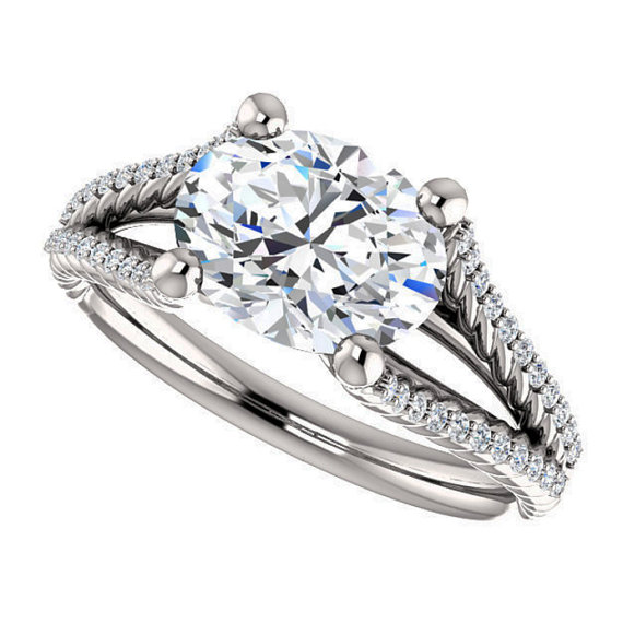 east-west engagement ring with an oval diamond